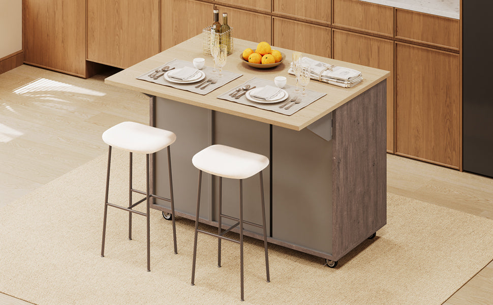 Compact kitchen island with light wood countertop and grey base featuring two white stools for breakfast nook