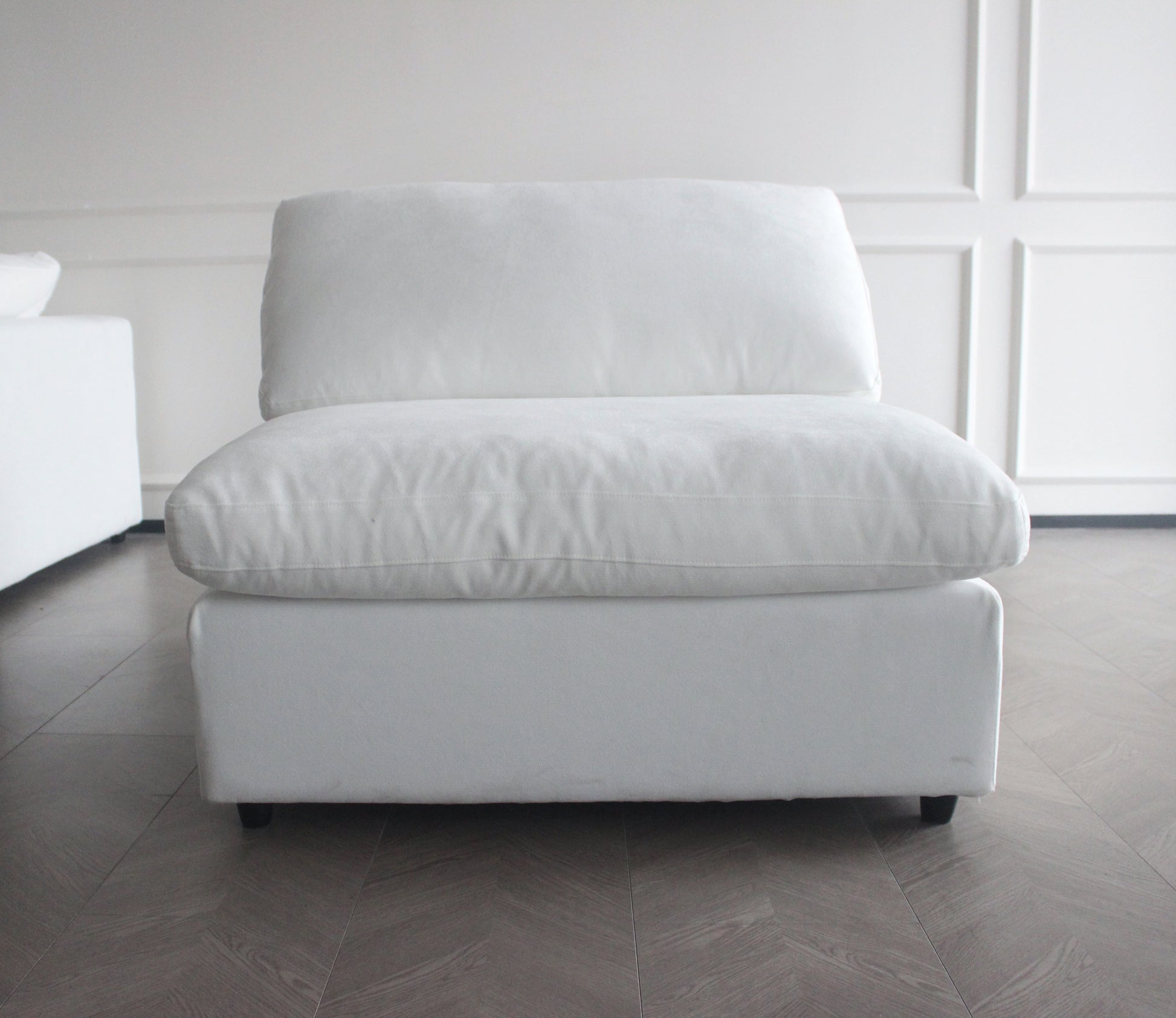 Plush white armchair with deep cushions perfect for a cozy living room