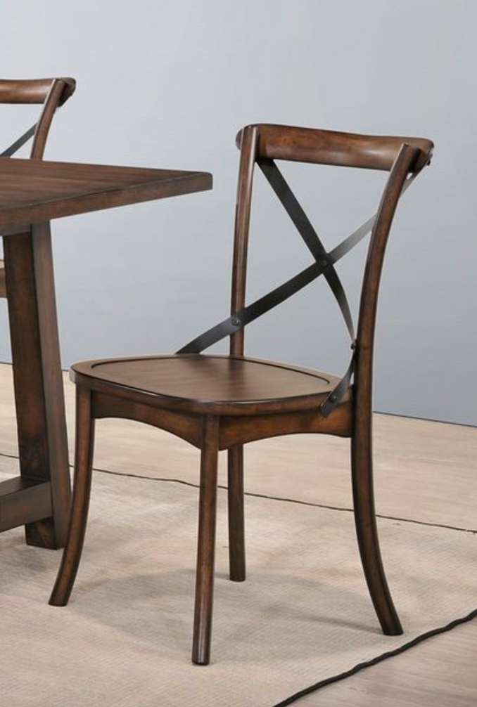 Brown wooden dining chair with crisscross backrest and dark metal accents