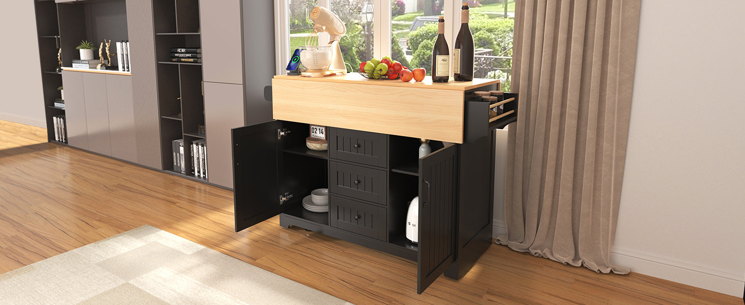 Black kitchen island with open doors revealing storage light wood countertop and mixer