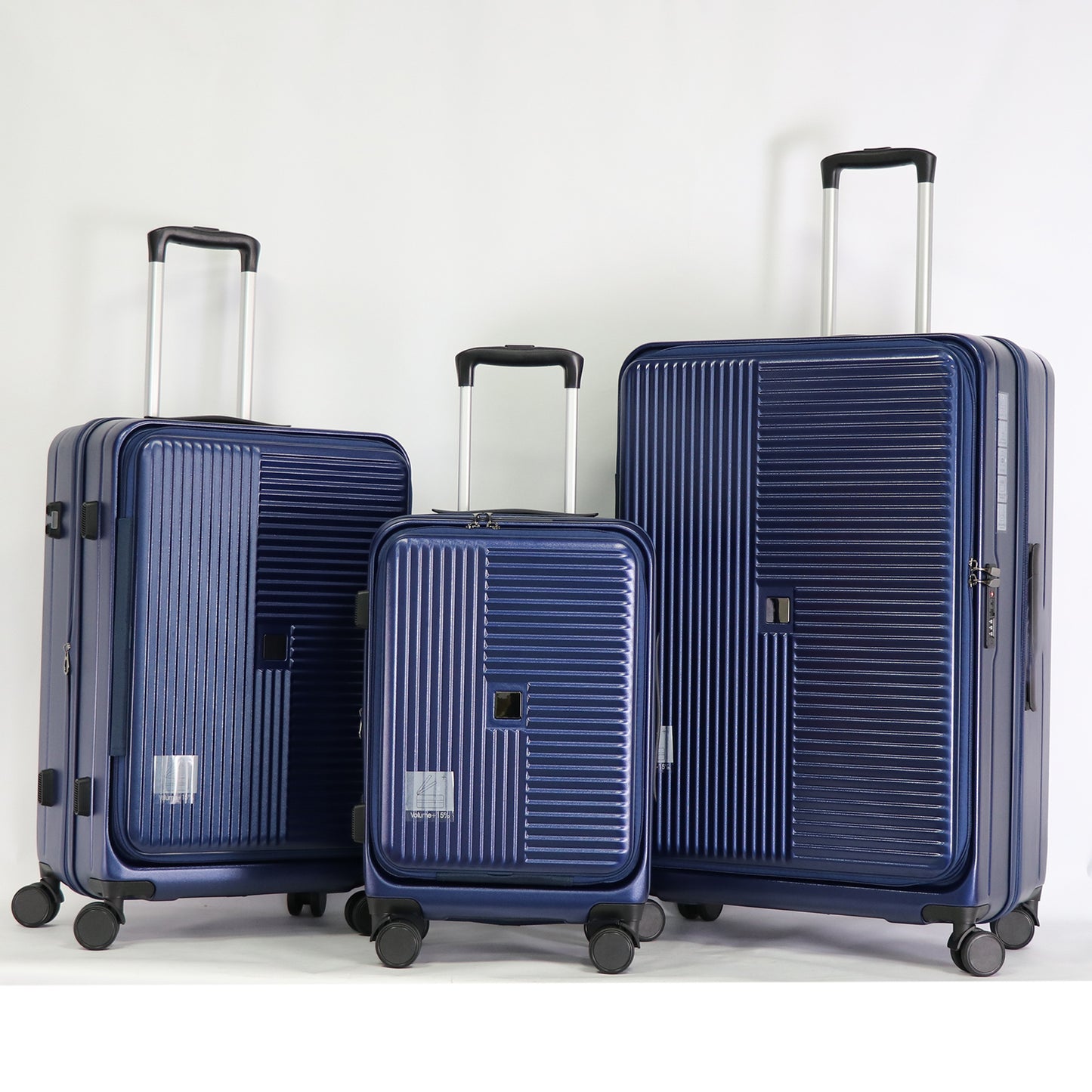 Set of three navy blue hardside suitcases with telescoping handles and spinner wheels