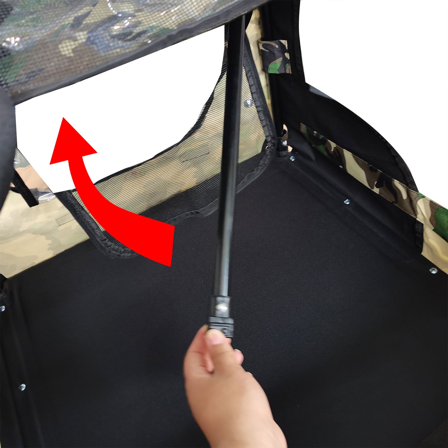 Camo hunting blind assembly hand attaching support pole to mesh window
