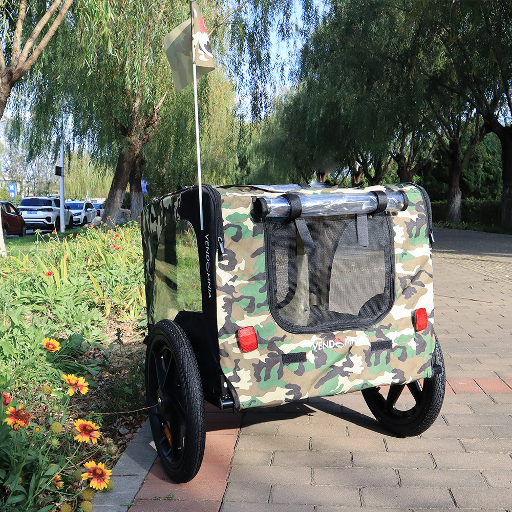 Camouflage dog trailer with mesh windows and a safety flag perfect for pet travel