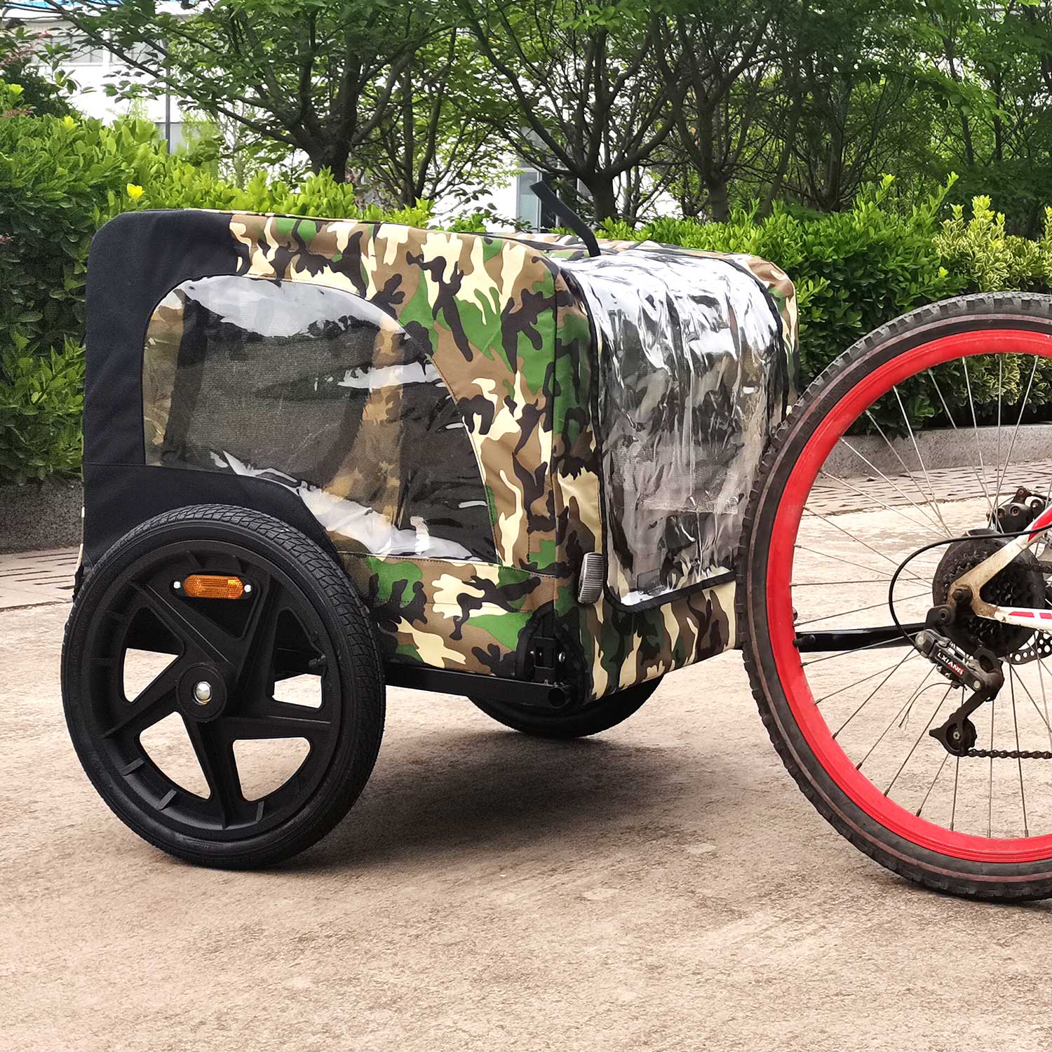 Camouflage print bicycle trailer with clear windows and black wheels
