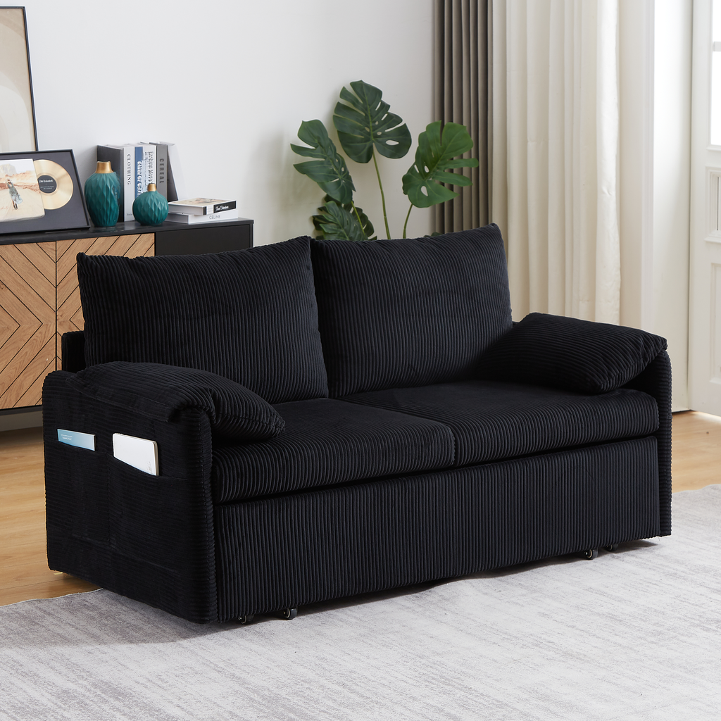 Black corduroy sofa with plush cushions and convenient side pockets