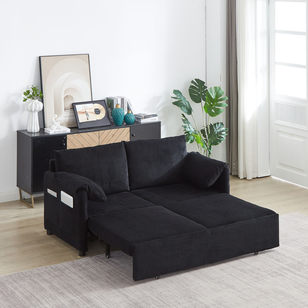 Black corduroy sofa bed with chaise extended for lounging
