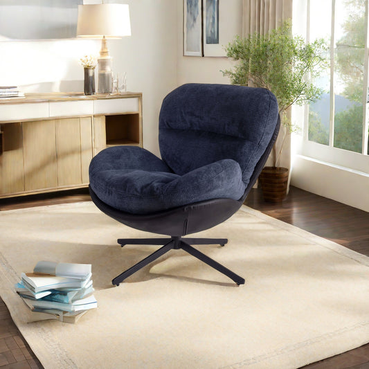 Deep blue corduroy swivel accent chair with black leather base and plush cushions
