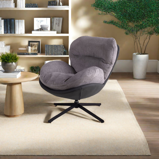 Plush grey upholstered swivel chair with black leather accents perfect for a modern living room