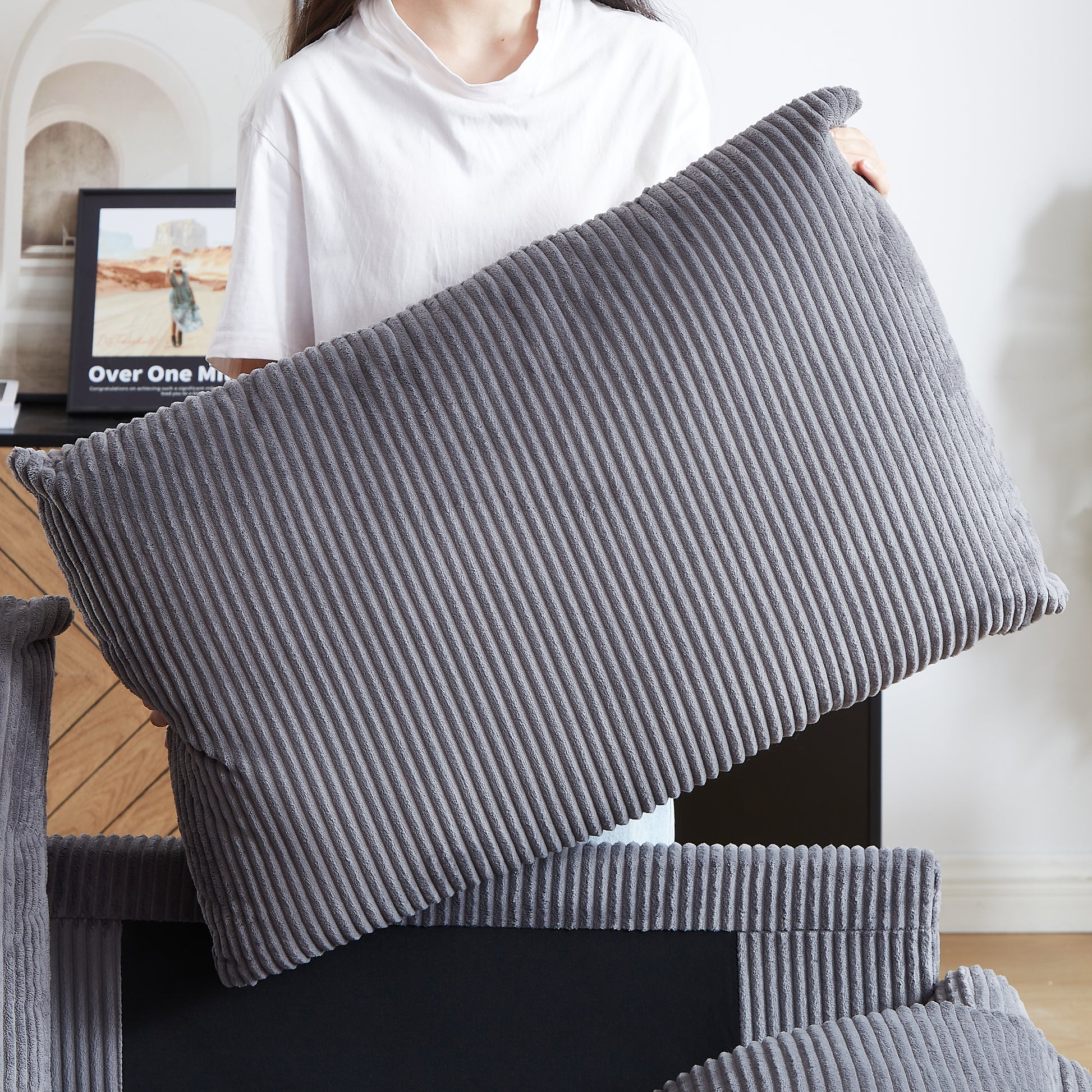 Gray corduroy lumbar pillow with soft texture and ribbed design for cozy comfort