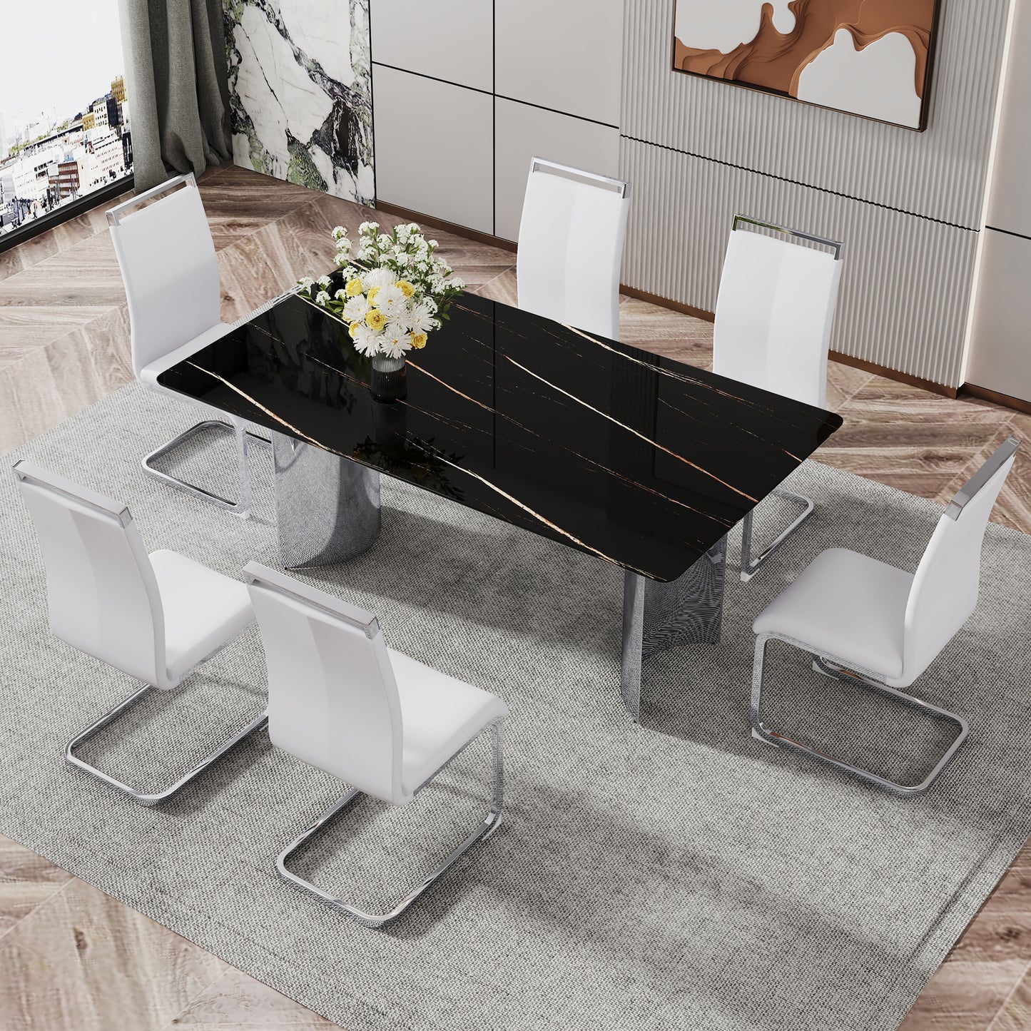 Sleek black marble dining table with gold veining paired with six white faux leather chairs
