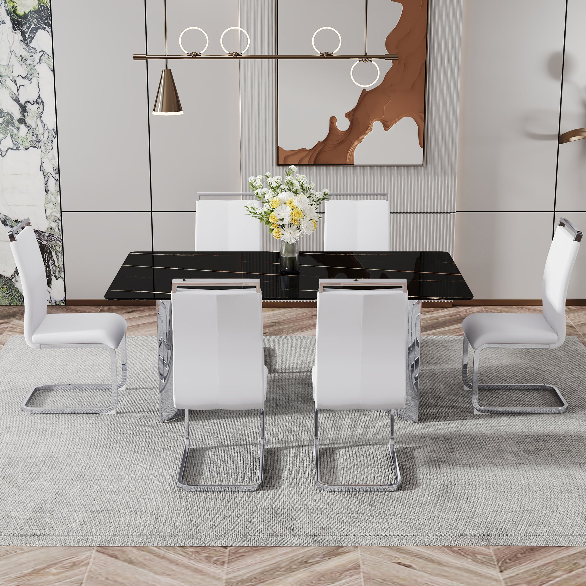 Modern white dining chairs with chrome cantilever legs set around a black marble dining table