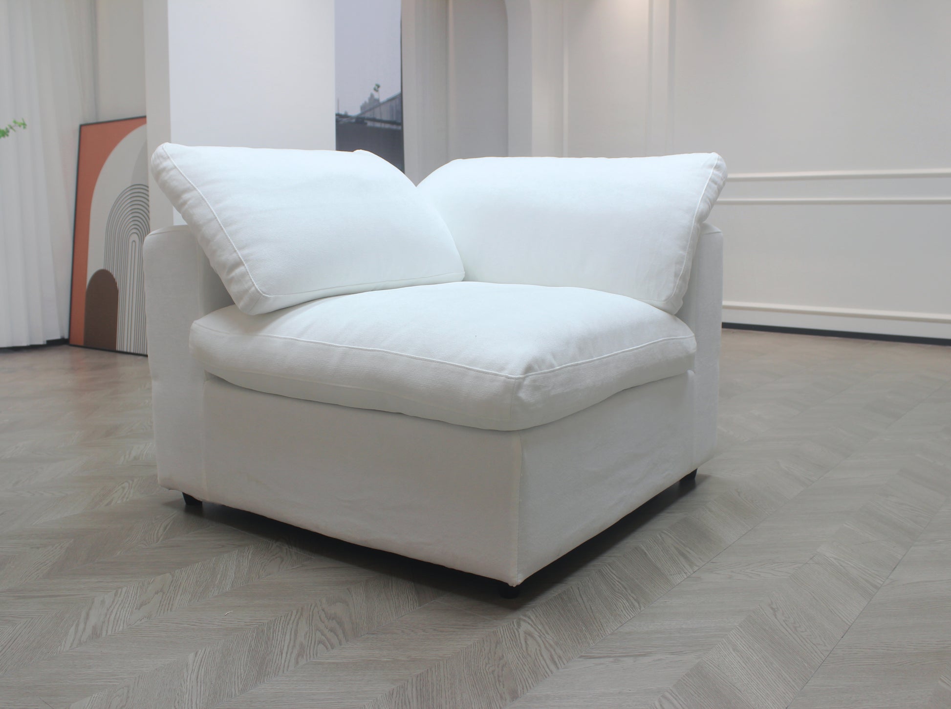 Comfortable white linen modular sofa with deep seating and plush cushions