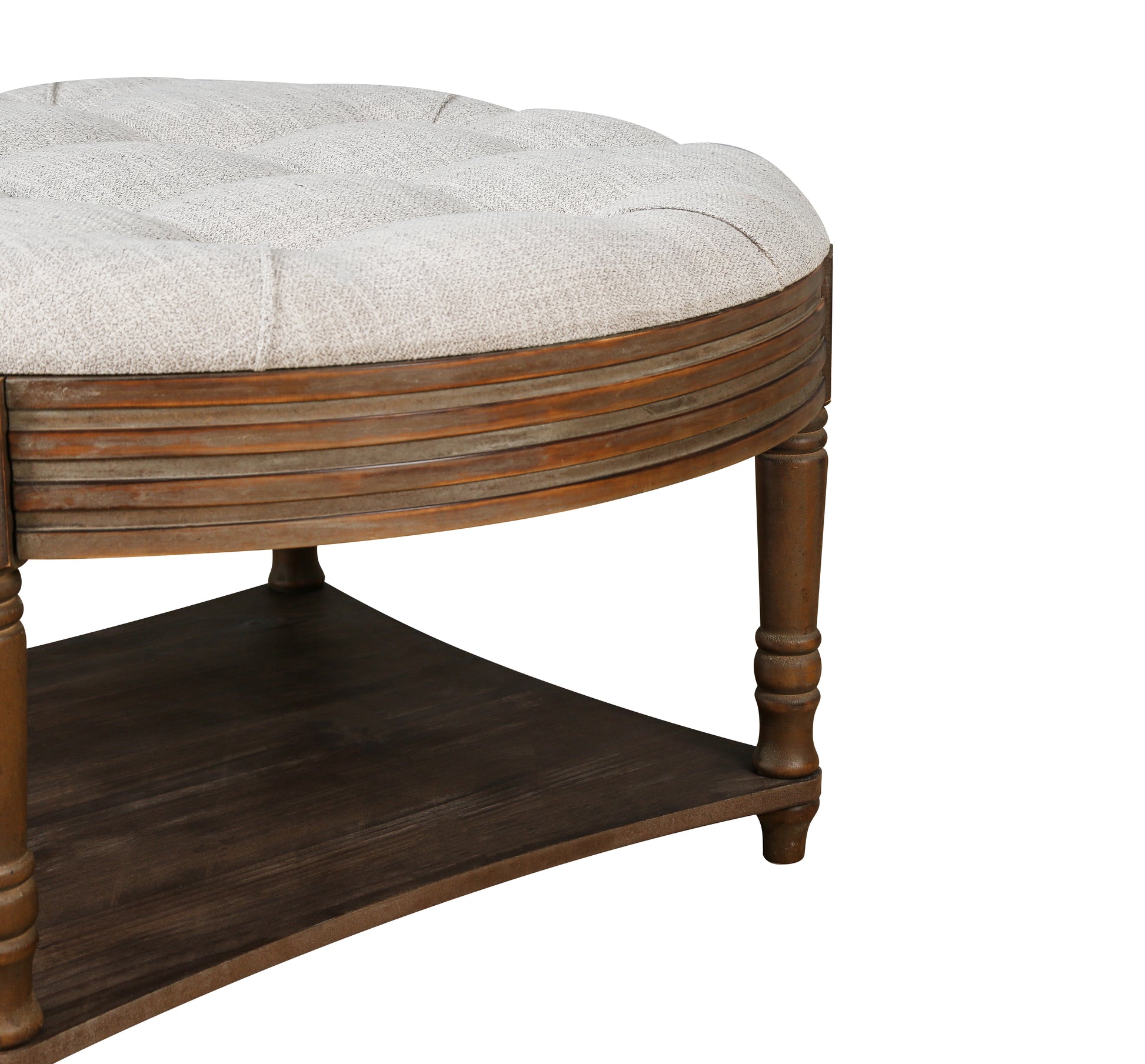 Tufted linen upholstered round ottoman with a wood slatted base and dark wood shelf