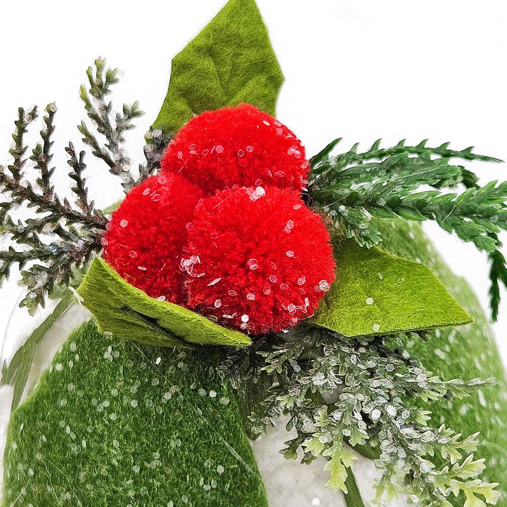 Felt Christmas ornament with red pompom berries and green leaves accented with faux snow