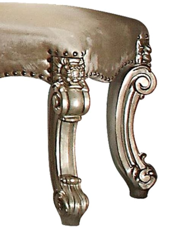 Ornate silverfinished carved cabriole leg on upholstered stool