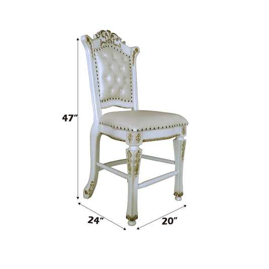 White tufted armchair with antique gold trim