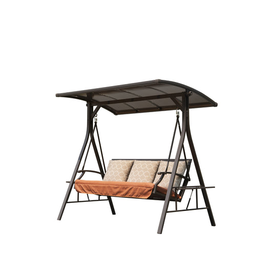 Dark brown metal patio swing with arched canopy and rust orange cushions