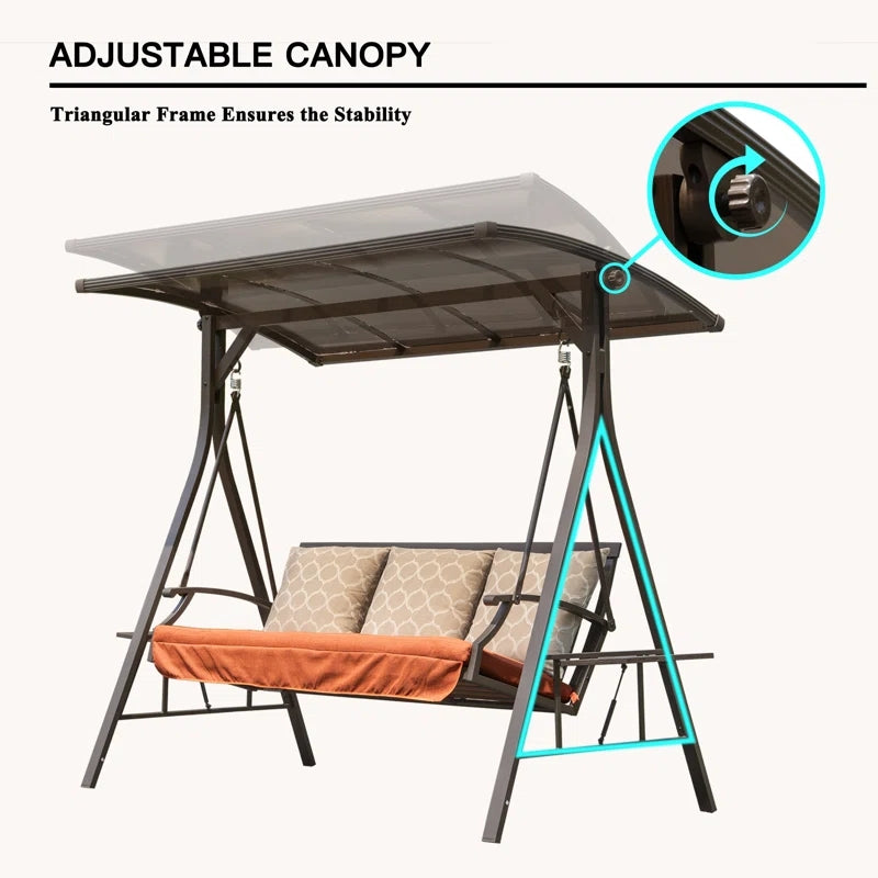 Bronze metal patio swing with adjustable canopy and ornate patterned cushions