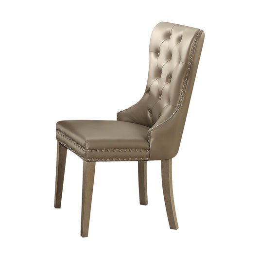 Tufted champagne accent chair with silver nailhead trim and wooden legs
