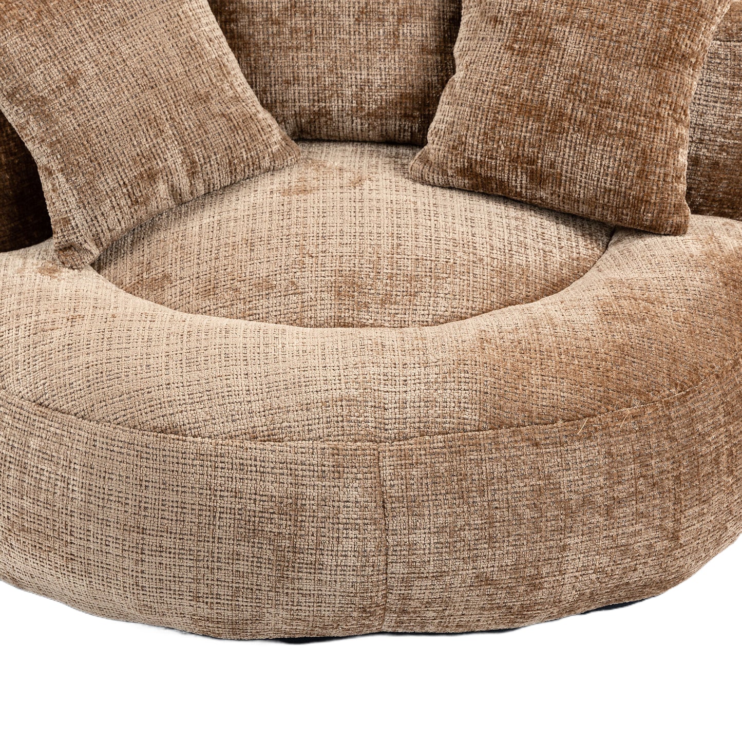 Plush brown round sofa with textured upholstery and coordinating throw pillows
