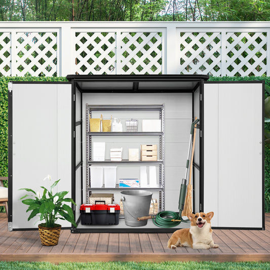Outdoor storage shed with metal shelves holding cleaning supplies and a toolset