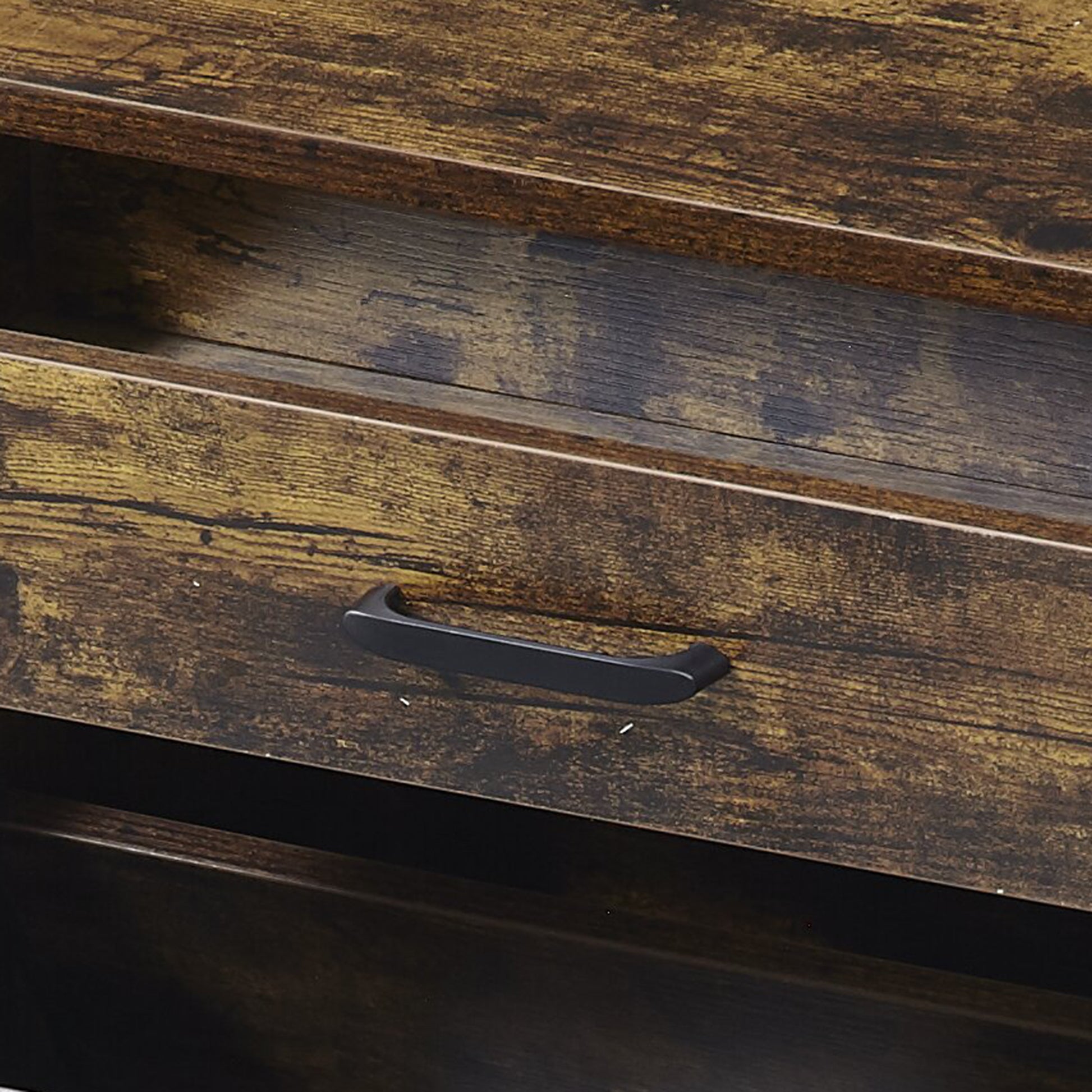 Rustic brown wood drawer with black handle part of a vintage dresser