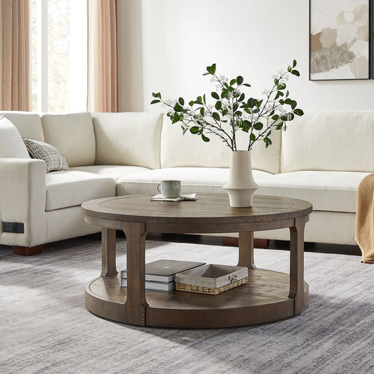 Round distressed wood coffee table with lower shelf and woven basket for living room decor