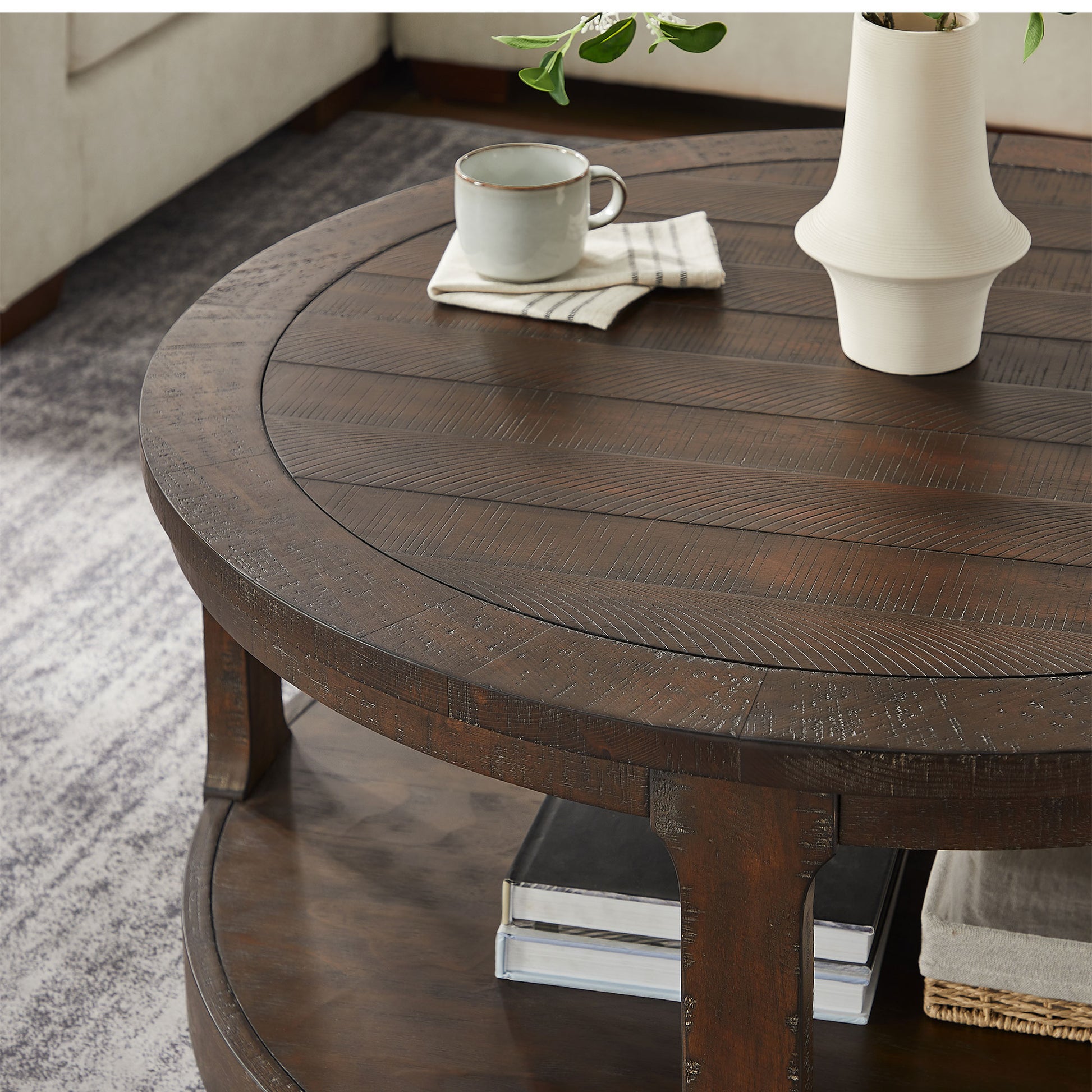 Rustic dark wood round coffee table with planked surface and lower shelf  characters