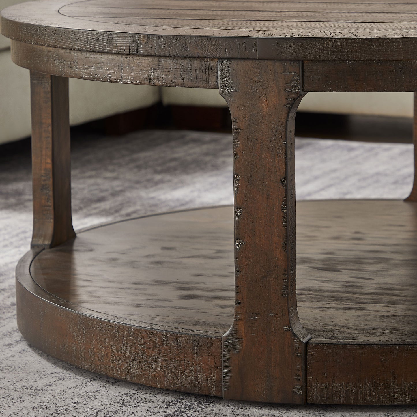 Rustic dark wood round coffee table with a textured finish and lower shelf