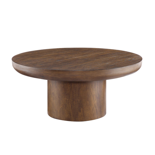 Round oak coffee table with natural wood grain and a pedestal base