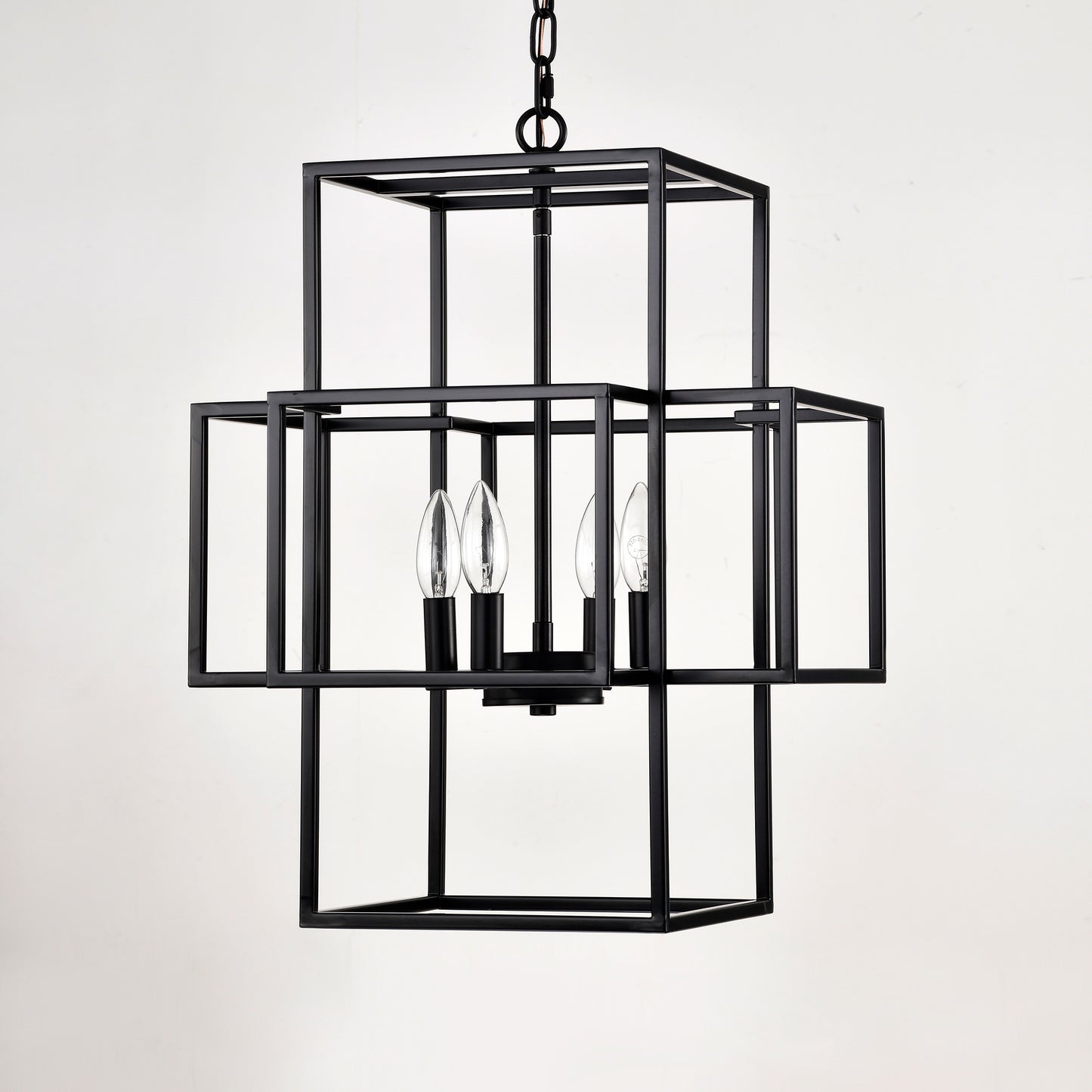 Modern black metal geometric chandelier with four clear candelabra bulbs for dining room lighting