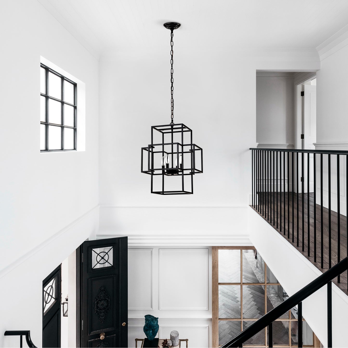 Modern geometric black chandelier with three exposed bulbs a statement piece for entryway lighting