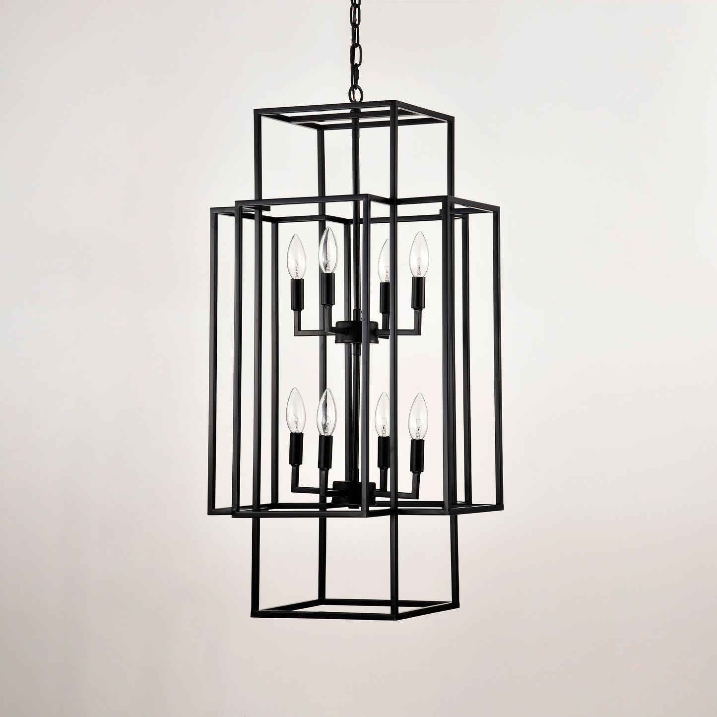 Black metal geometric tiered chandelier with eight exposed bulbs
