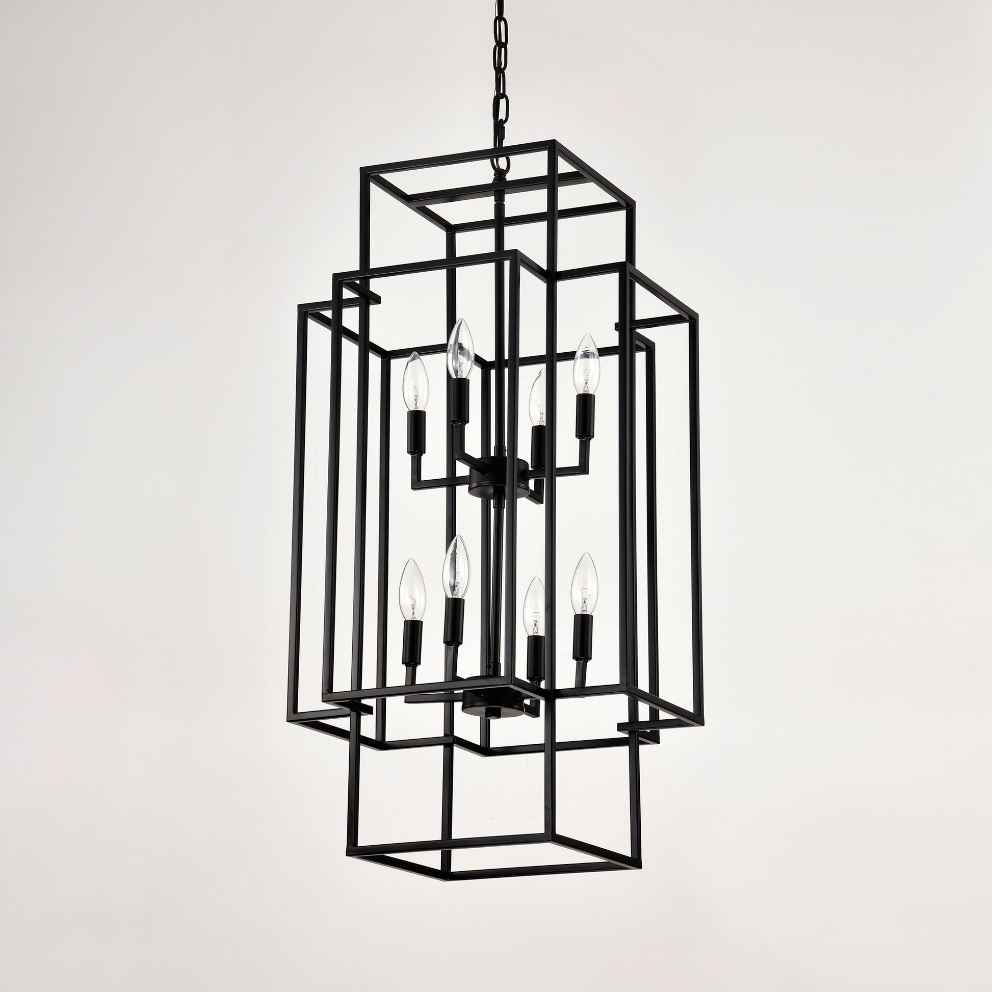 Modern black metal geometric chandelier with eight clear bulbs ideal for dining rooms