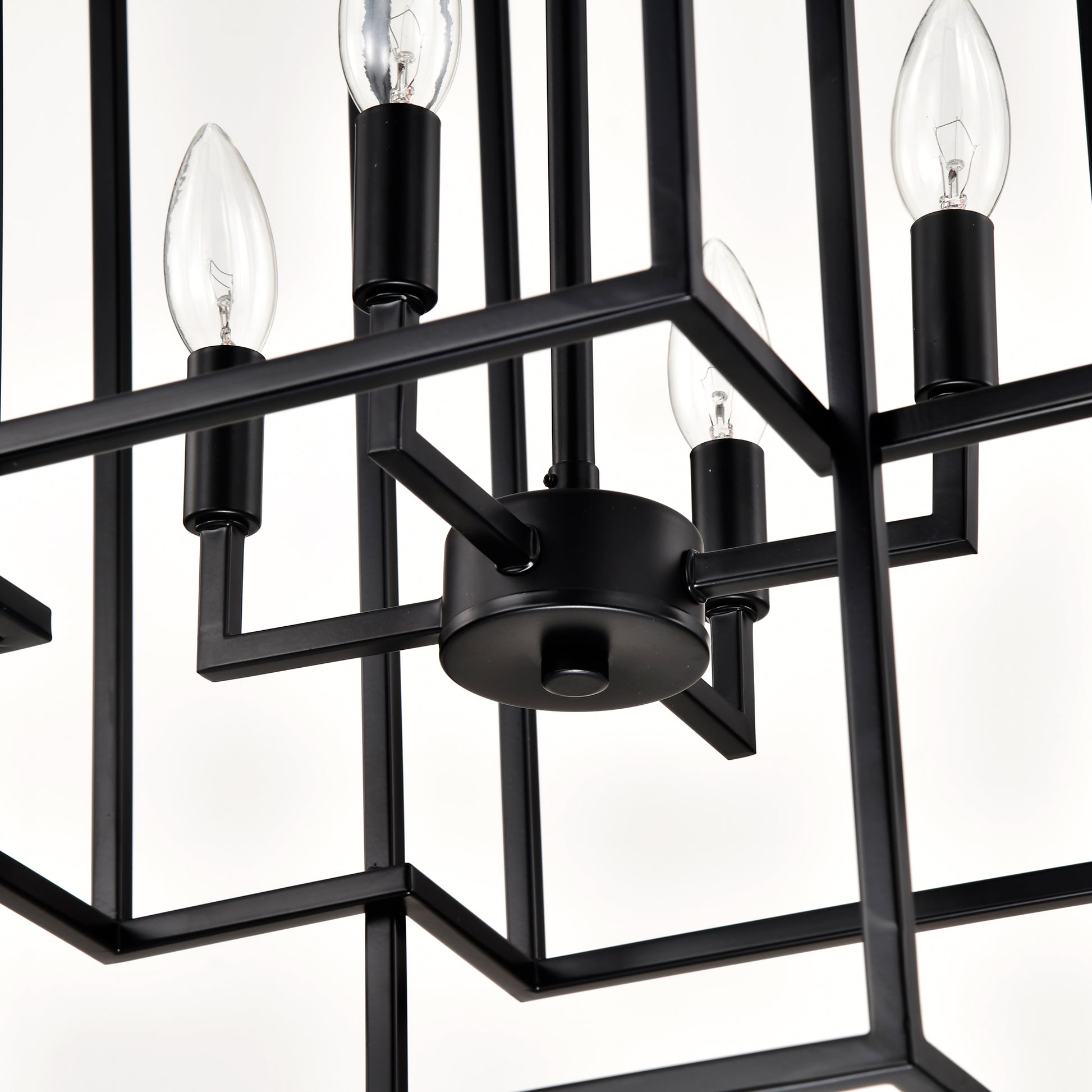 Closeup of a modern black metal cage chandelier with clear Edison bulbs