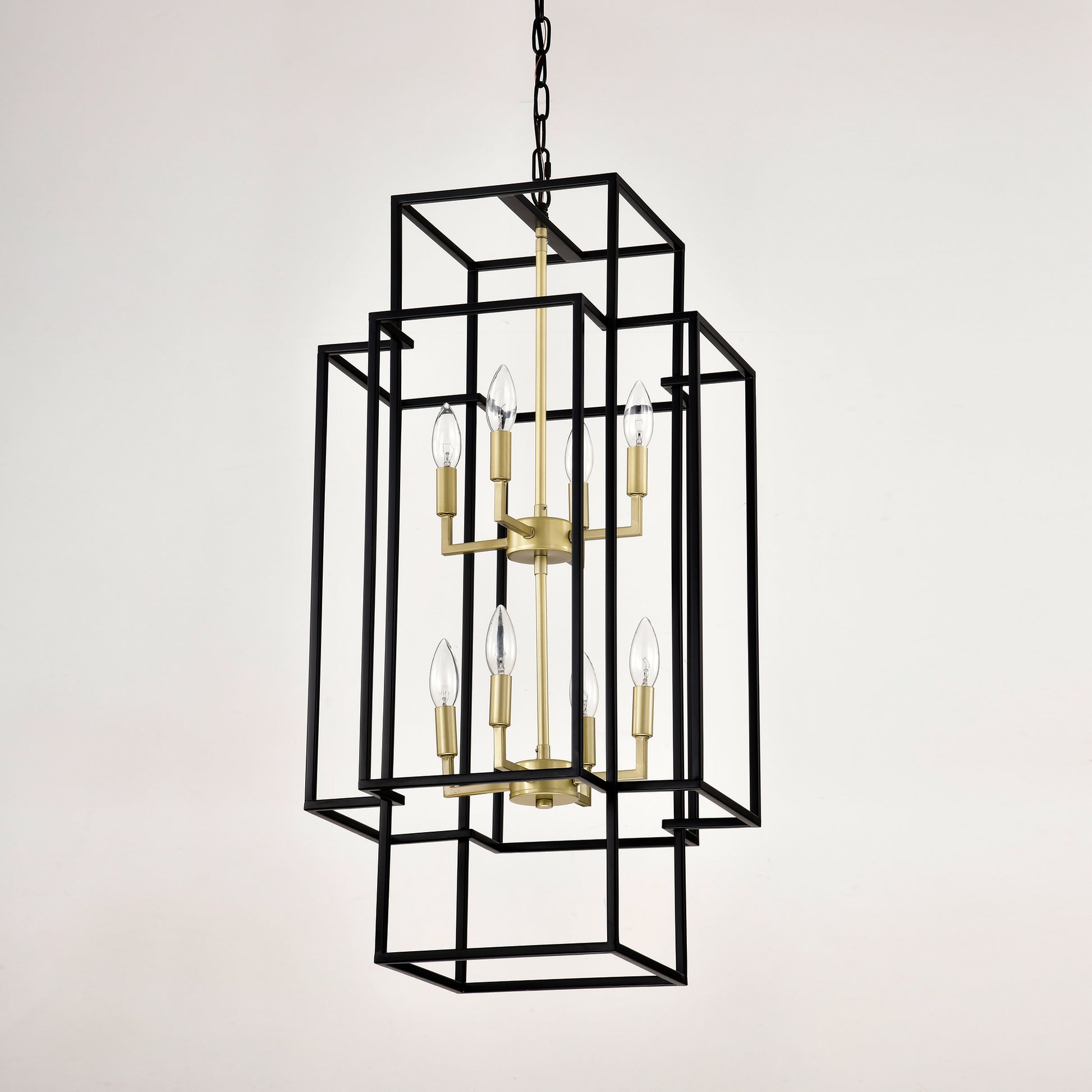 Modern black geometric chandelier with brass accents and six candelabra bulbs
