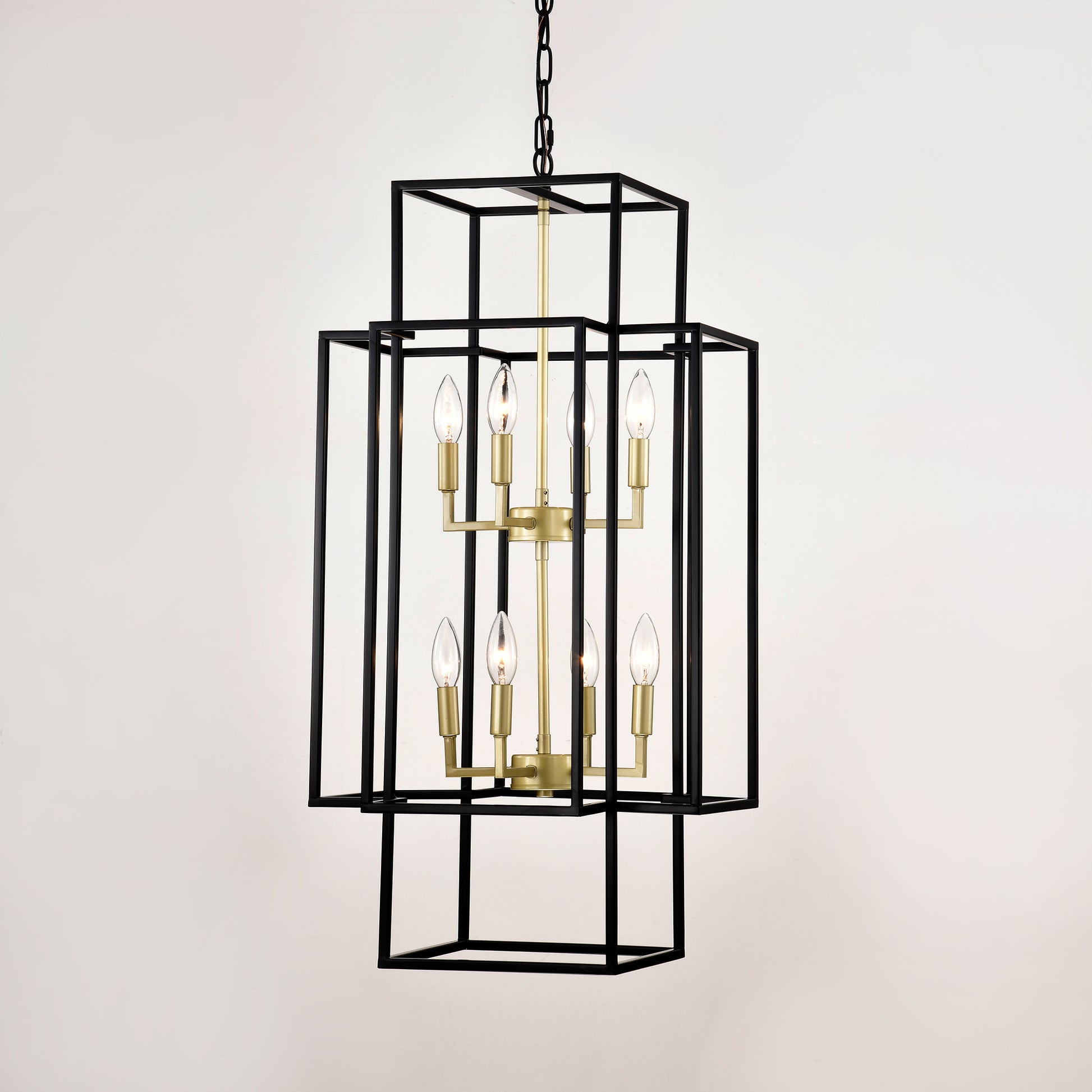 Modern black geometric chandelier with brass accents and eight candle bulbs