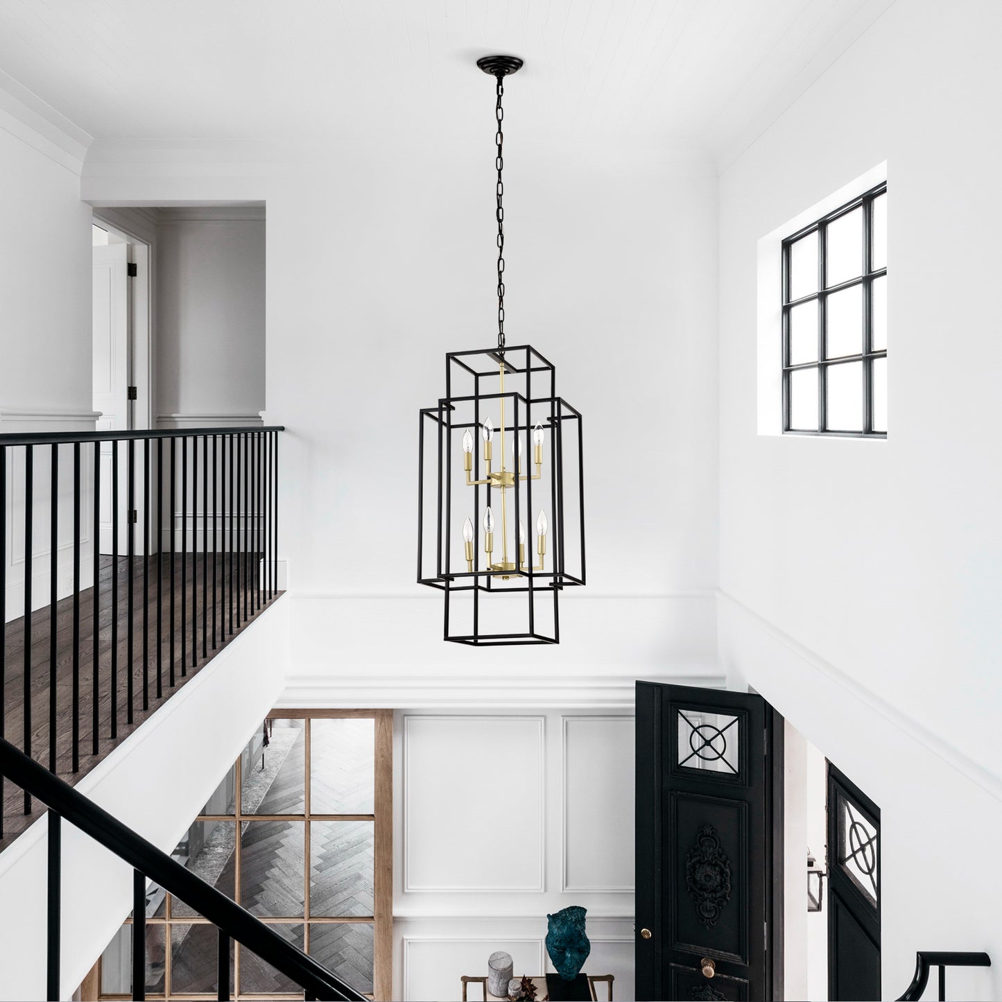 Geometric black metal and brass chandelier with six bulbs perfect for hallways