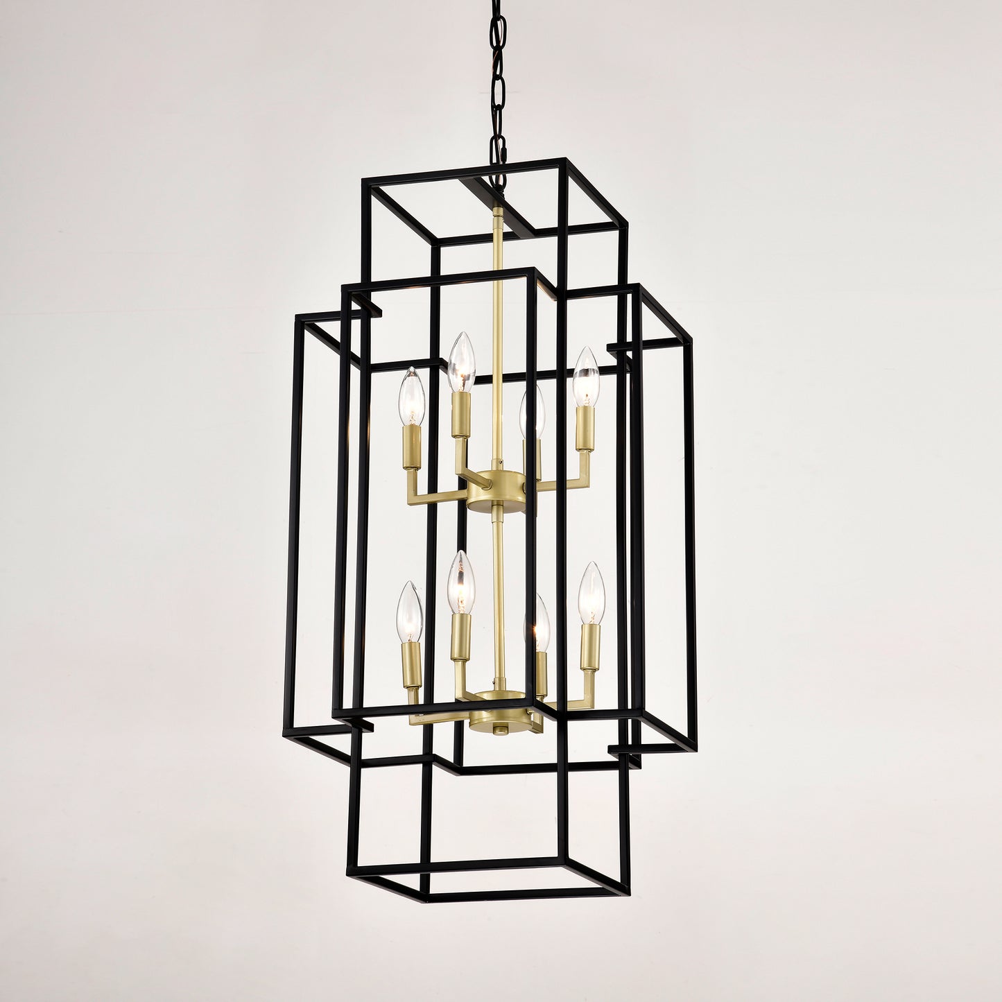 Black geometric chandelier with brass accents and clear bulbs
