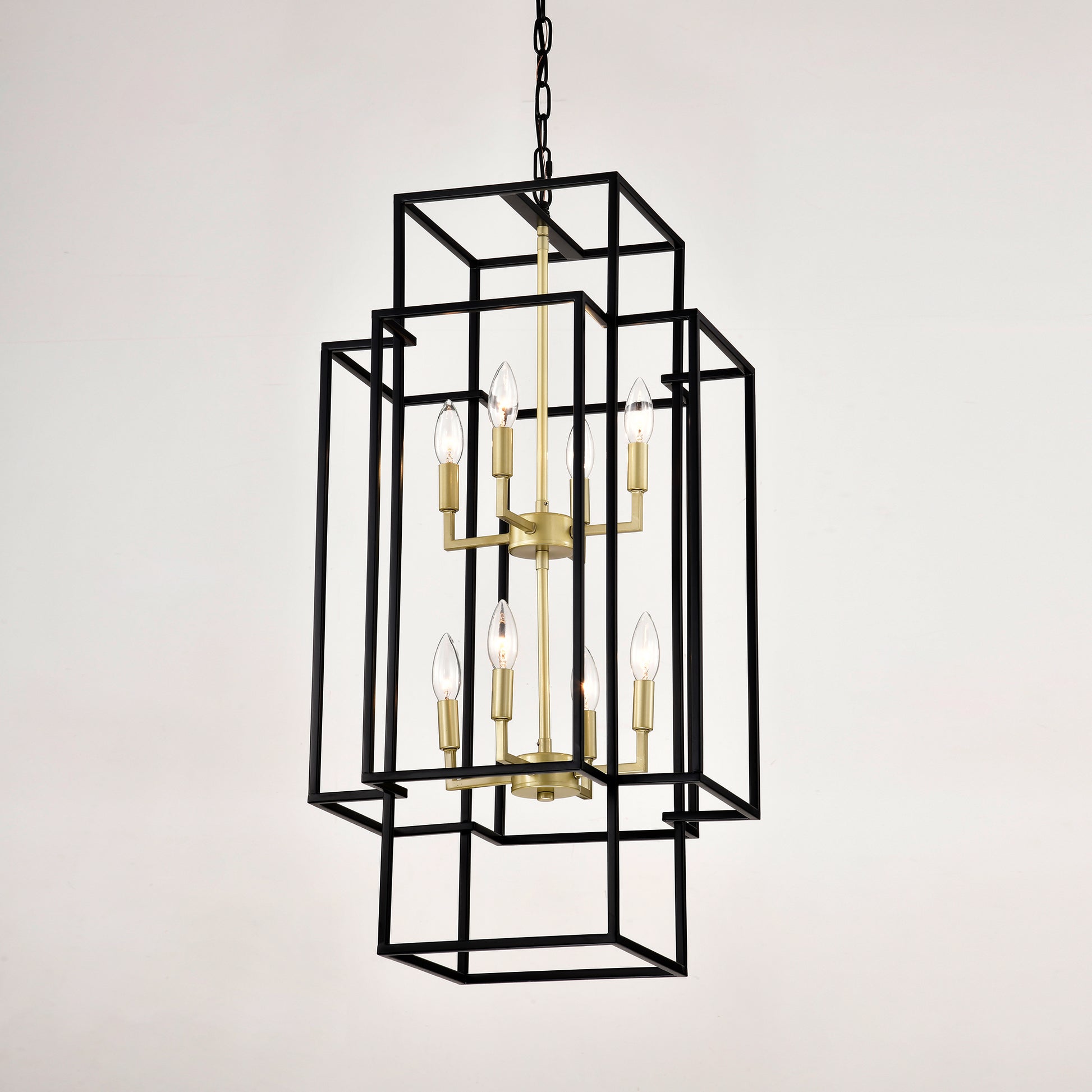 Black geometric chandelier with brass accents and clear bulbs