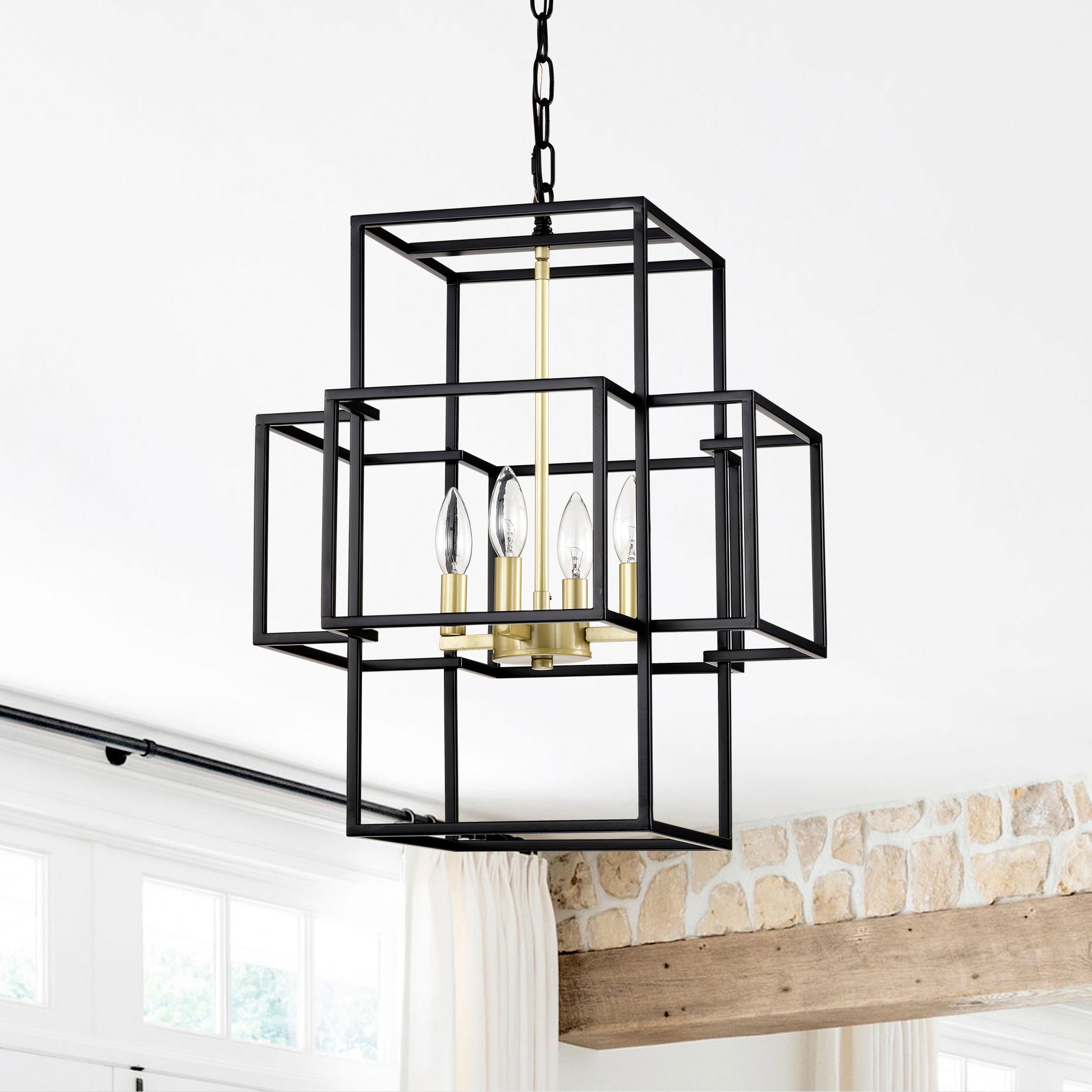 Black geometric chandelier with gold accents and four candle bulbs