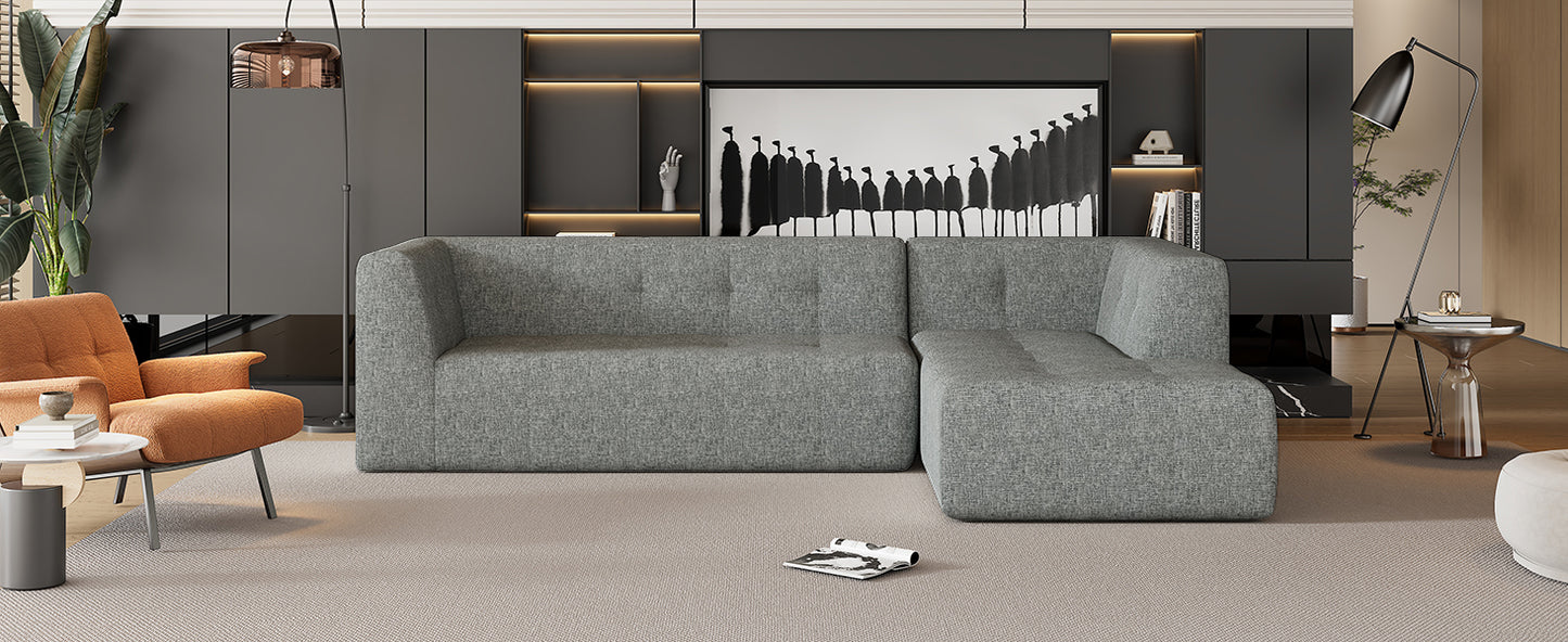Modern grey fabric sectional sofa with tufted cushions perfect for living room seating