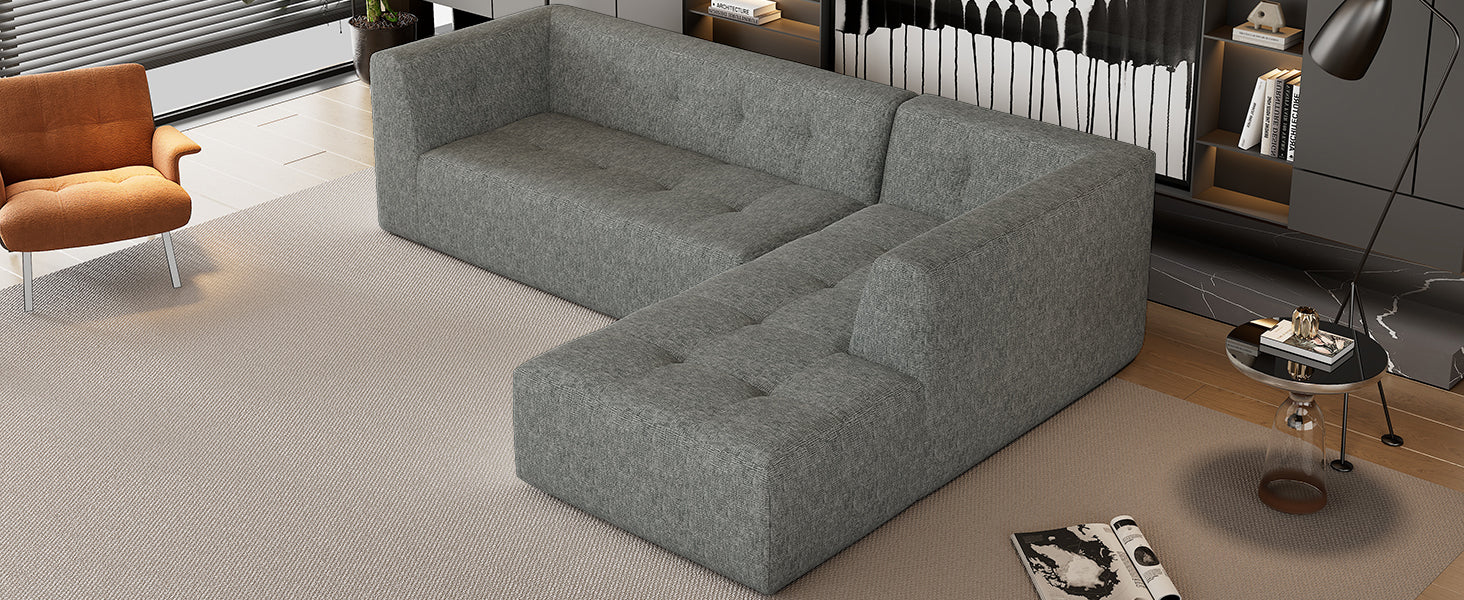 Modern grey fabric sectional sofa with tufted cushions ideal for living room seating