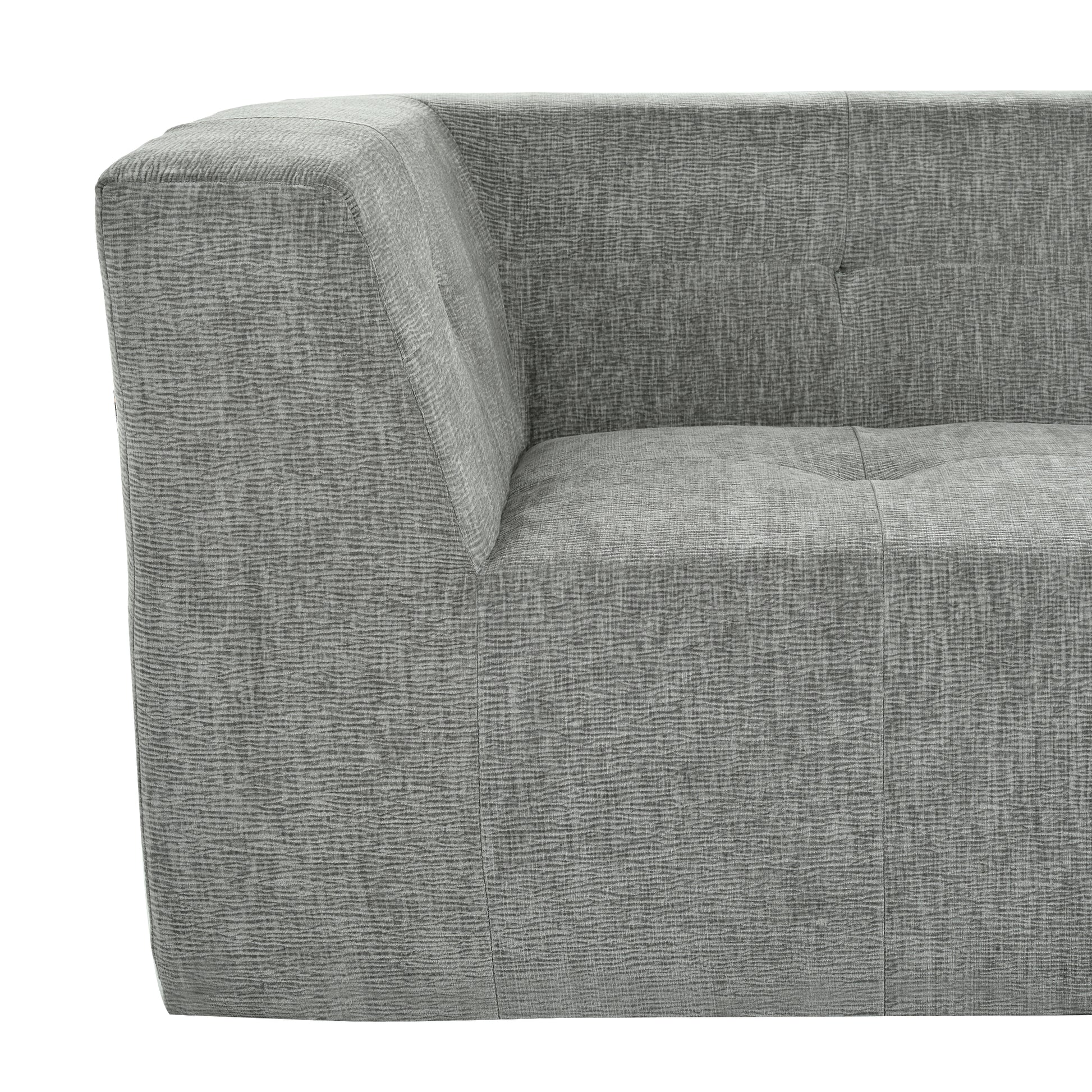 Close up of a textured grey fabric sofa showing detailed weave patterns and button tufting on the seat cushion
