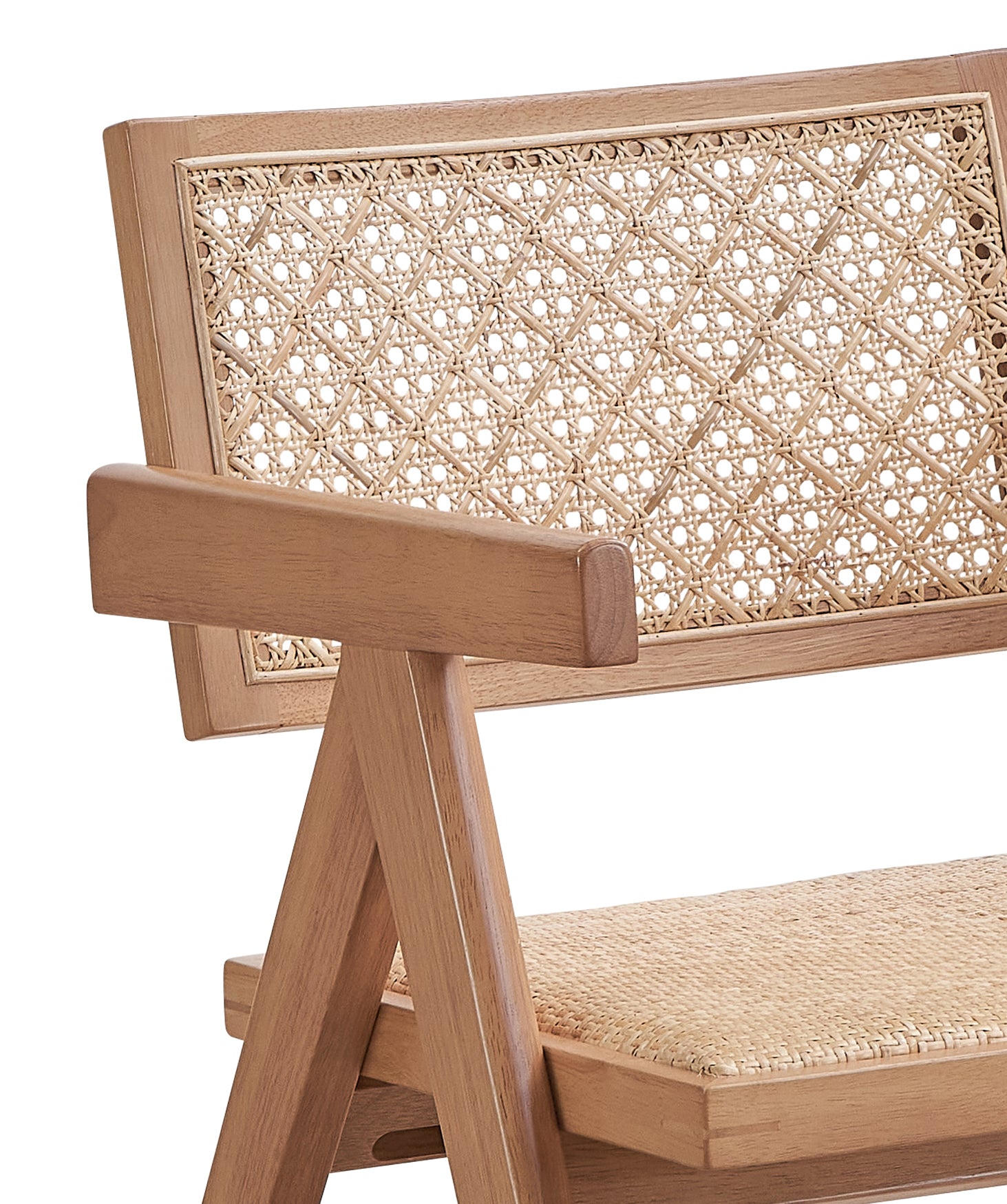 Natural wood armchair with intricate cane weaving on the back and seat