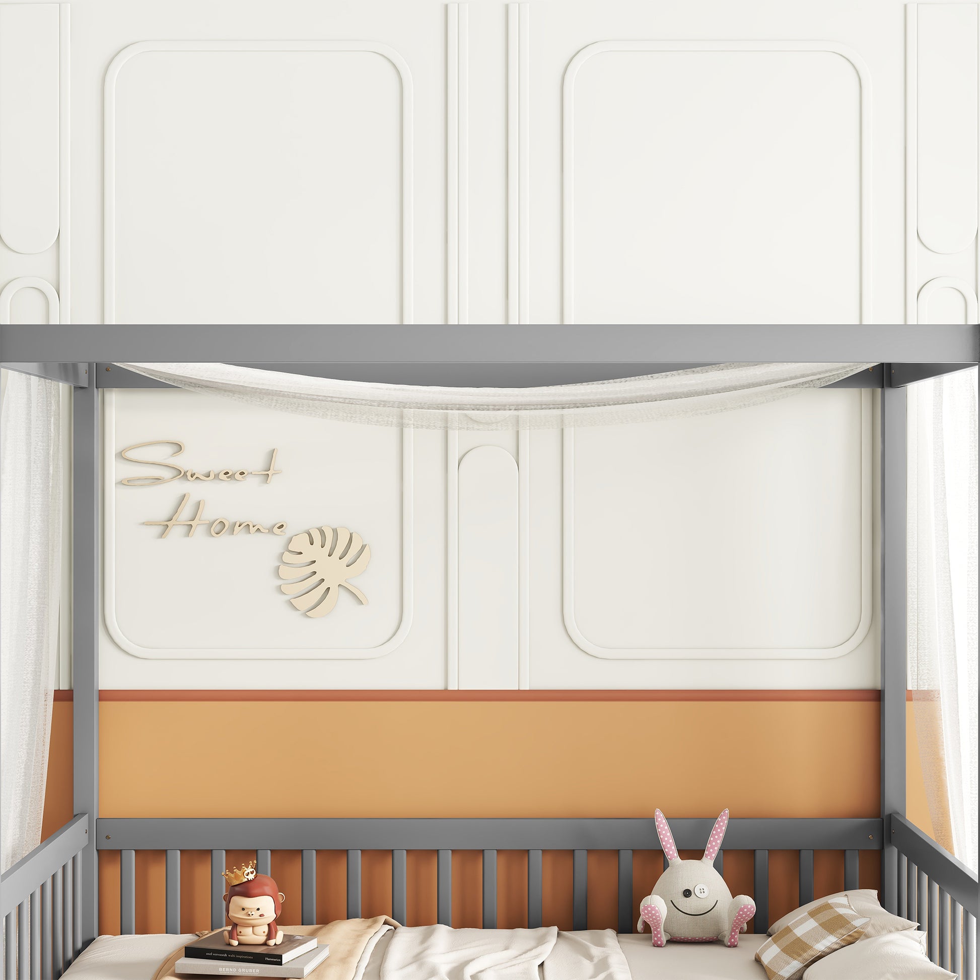Gray fourposter kids bed with white and orange accents and decorative wall art