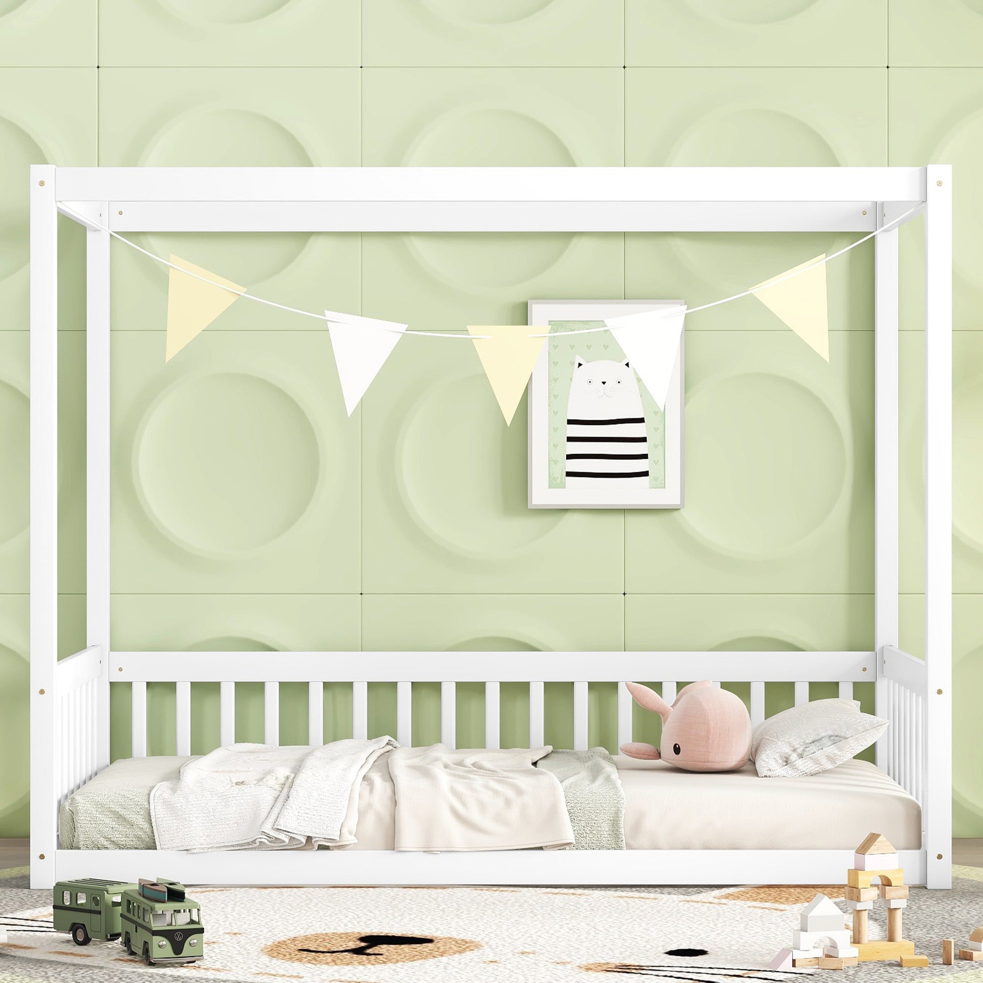 White wooden canopy bed with bedding and toys