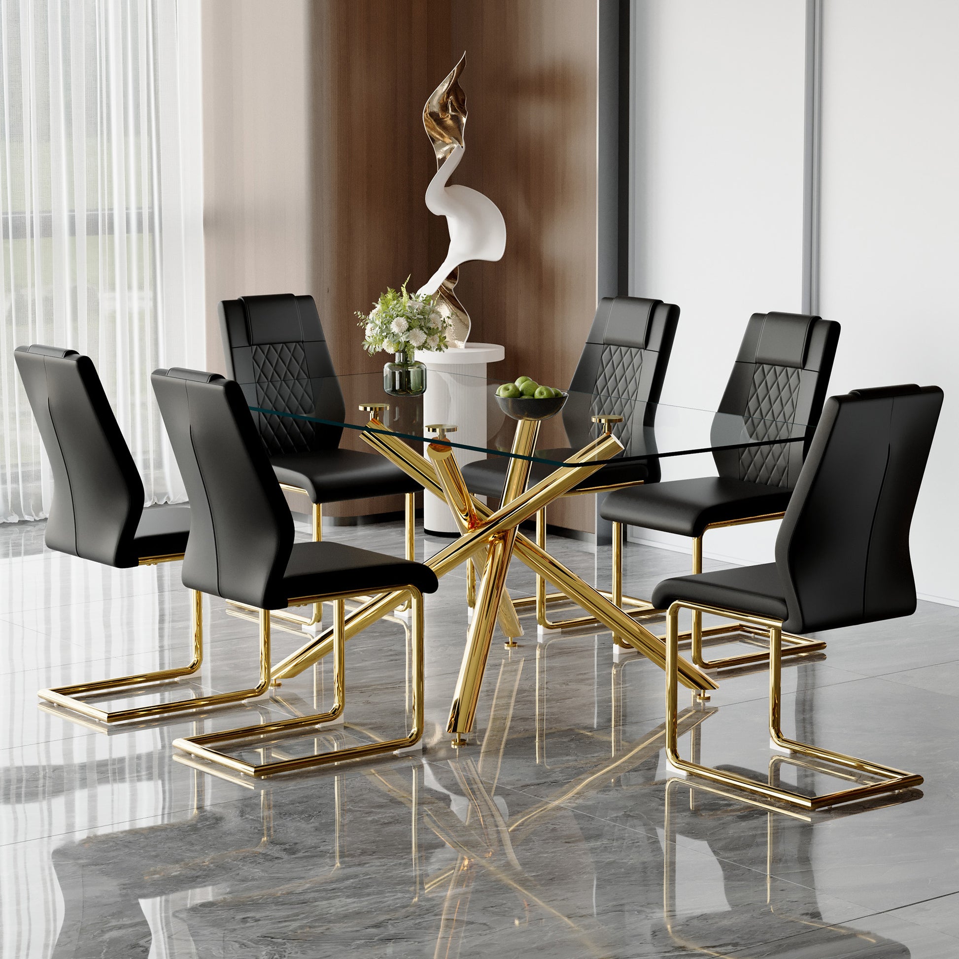 Modern glass dining table with six black upholstered chairs and gold legs