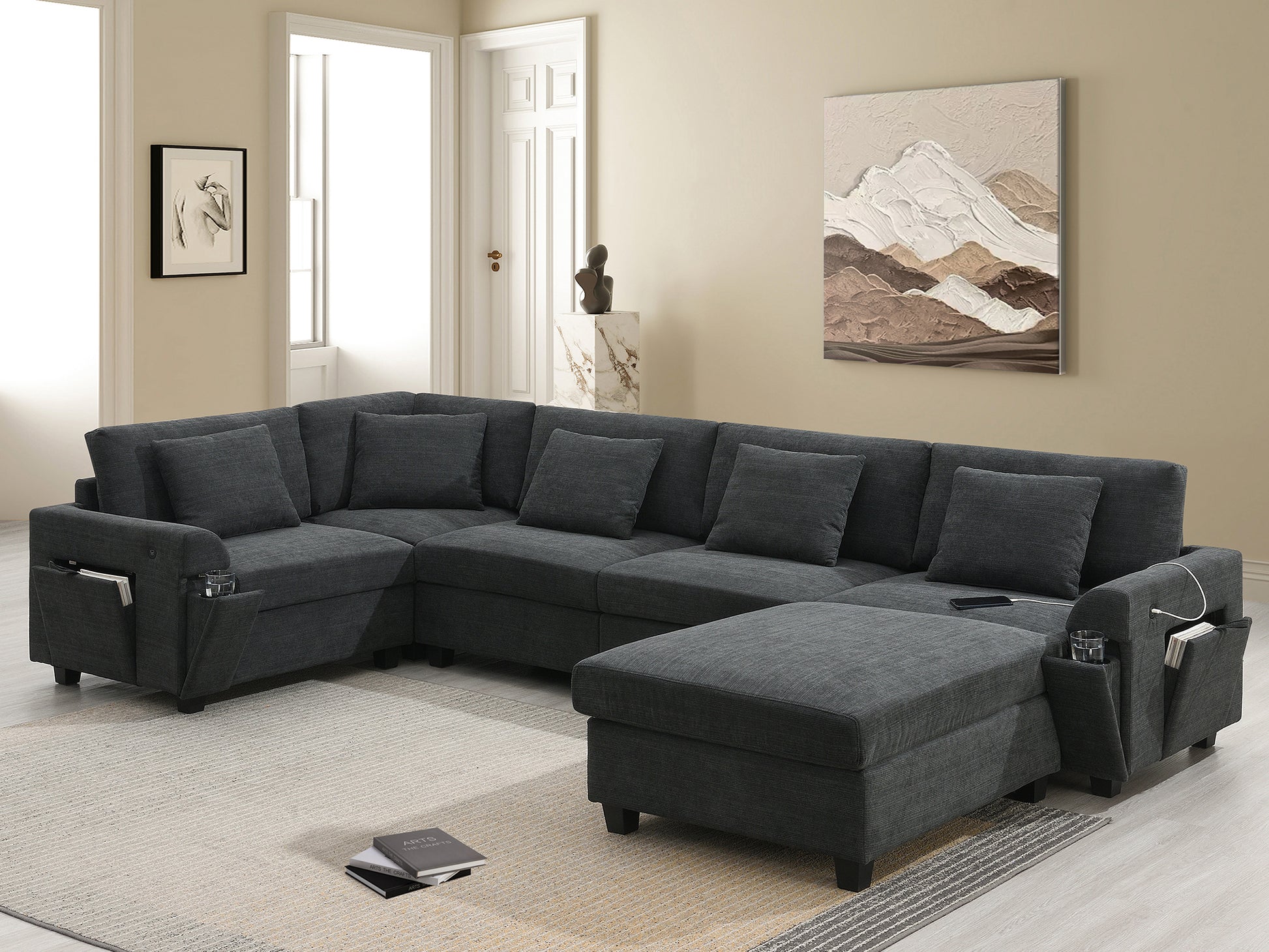 Dark gray fabric sectional sofa with builtin side storage pockets and cup holders