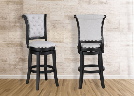 Tufted grey fabric swivel bar stool with nailhead trim and black wooden frame